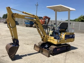 Багер Komatsu уникат 1500кг