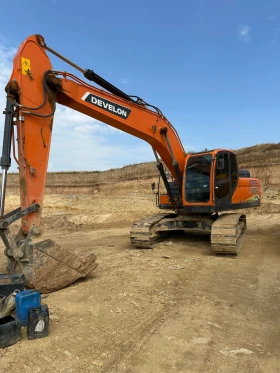 Багер Develon DX205