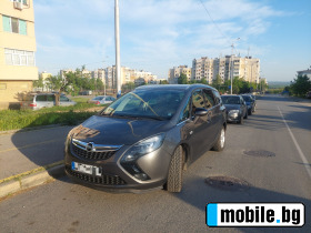     Opel Zafira Tourer ~13 000 .