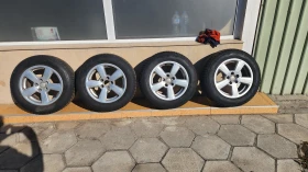 Гуми с джанти Bridgestone 195/65R15, снимка 1 - Гуми и джанти - 47503636