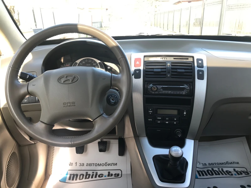 Hyundai Tucson 2.0 ЧИСТО НОВ-ГАЗ-БЕНЗИН-4?4, снимка 11 - Автомобили и джипове - 49063298