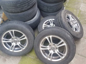 Гуми с джанти Hero 215/65R15, снимка 4 - Гуми и джанти - 48961031