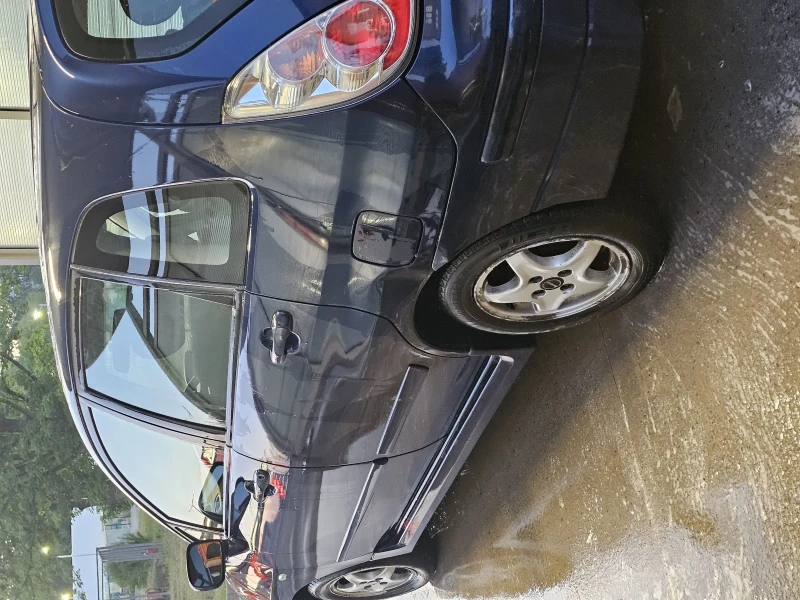 Suzuki Liana, снимка 4 - Автомобили и джипове - 52723573