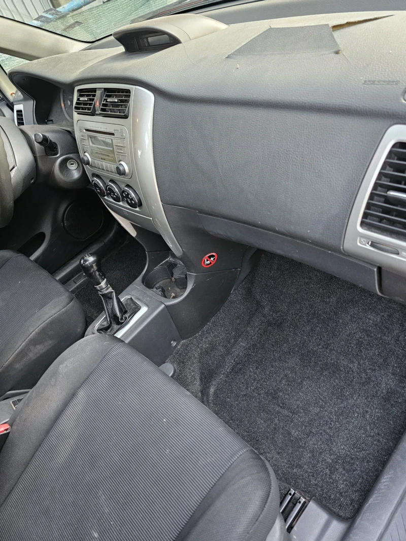 Suzuki Liana, снимка 9 - Автомобили и джипове - 52723573