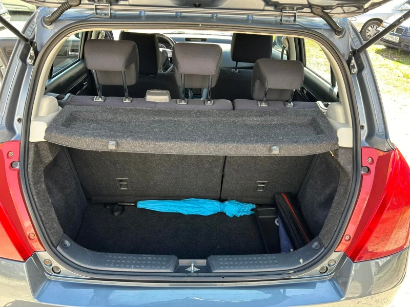 Suzuki Swift 1.3 4x4, снимка 13 - Автомобили и джипове - 52637108