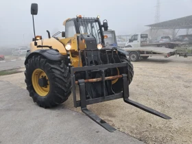 Телескопични товарачи Caterpillar TH407 C, снимка 3