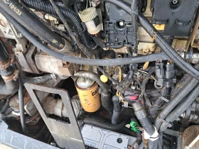 Телескопични товарачи Caterpillar TH407 C, снимка 13