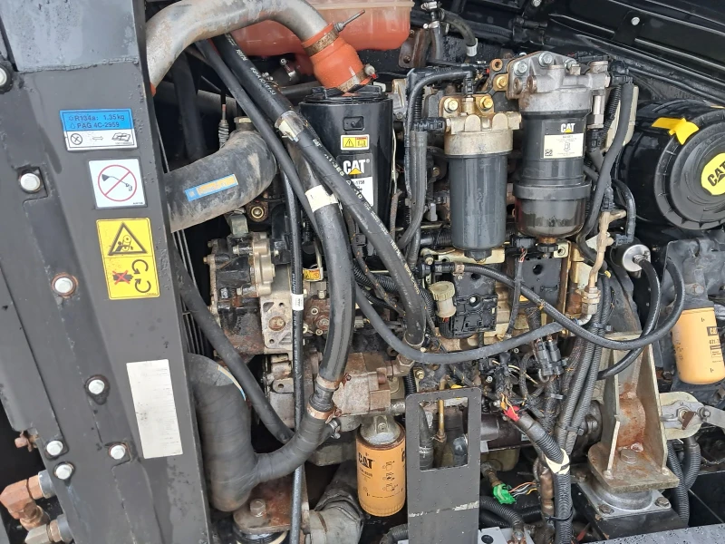 Телескопични товарачи Caterpillar TH407 C, снимка 12 - Индустриална техника - 52840920