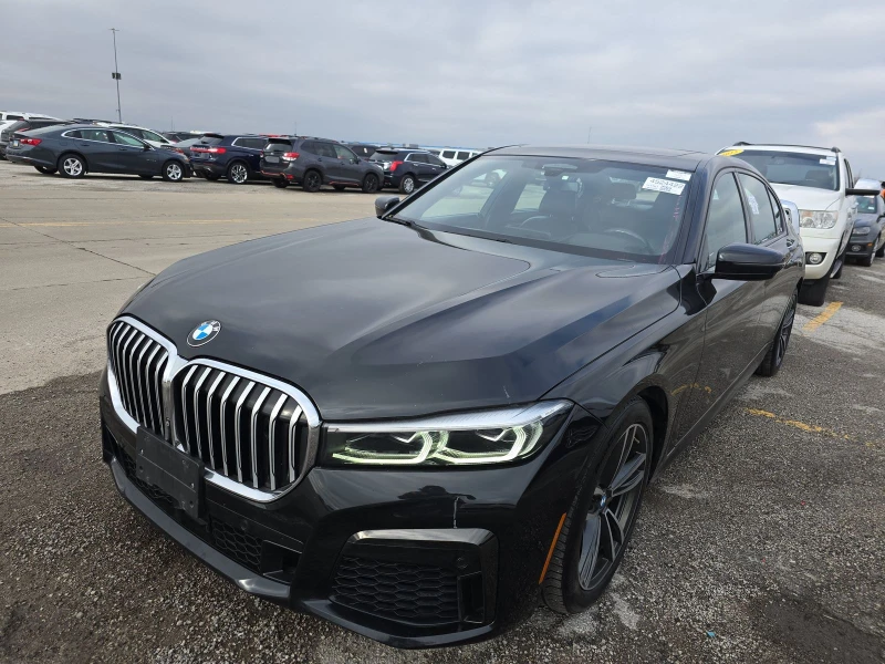 BMW 750 масаж* дистроник* M-pack* Harman* хедъп* обдух* fu, снимка 2 - Автомобили и джипове - 48467848