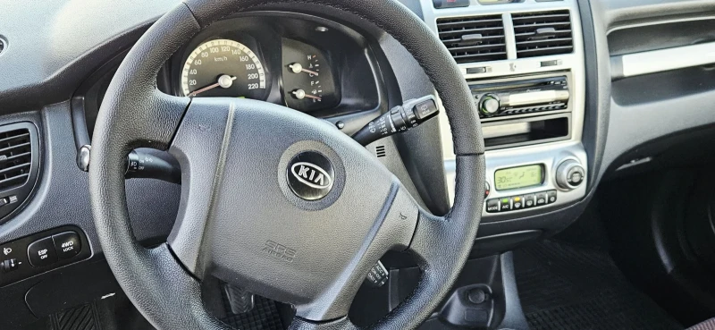 Kia Sportage 2.0i* 4X4* Полукожа* Подгрев , снимка 15 - Автомобили и джипове - 52938768