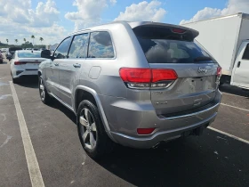 Jeep Grand cherokee 5.7 Overland/Крайна цена с вс. такси до България ! - [6] 