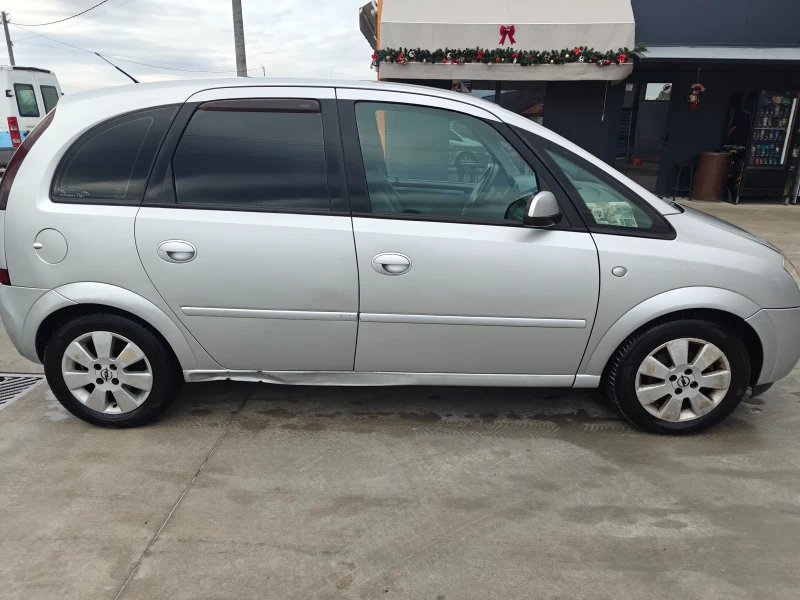 Opel Meriva 1.6 Газ, снимка 12 - Автомобили и джипове - 49471496