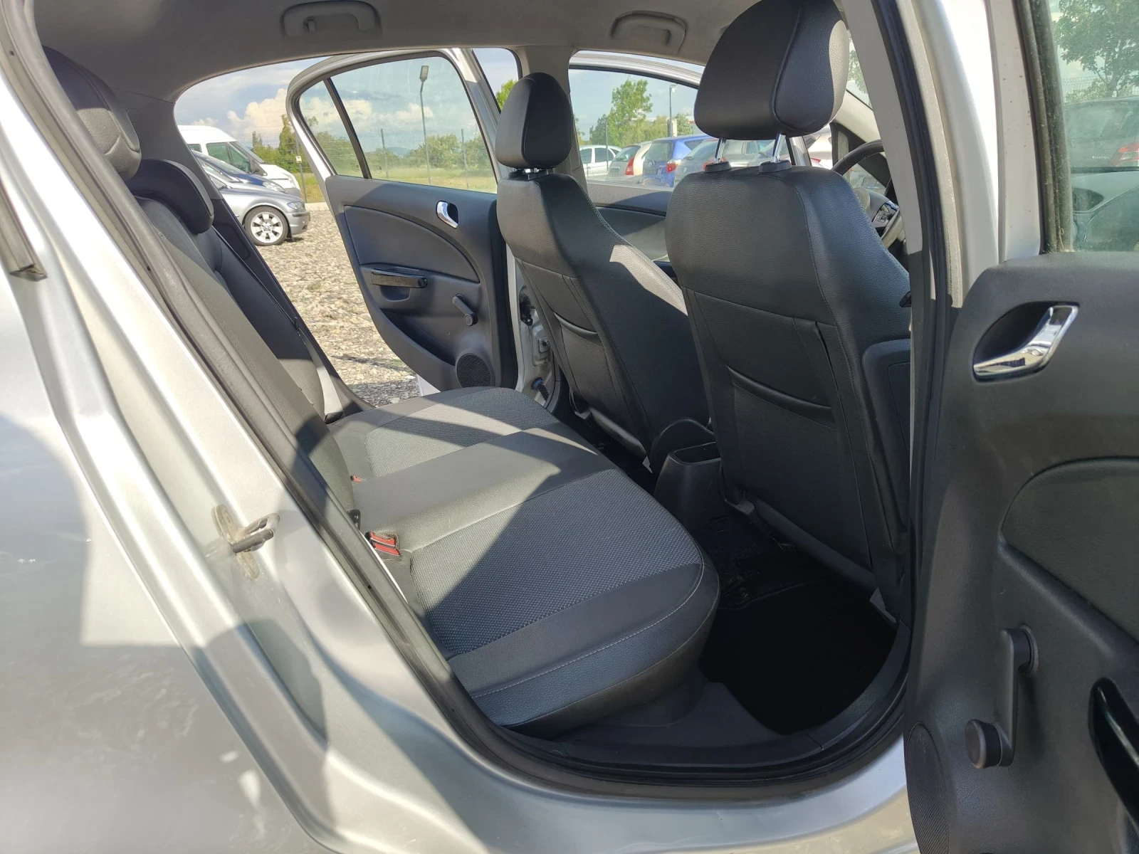 Opel Corsa 1.4i 90 COSMO xenon , снимка 14 - Автомобили и джипове - 54391569