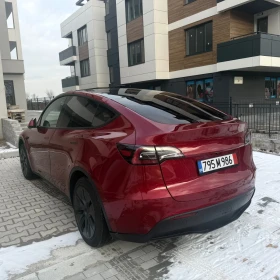 Tesla Model Y 2025 Long Range 12000 км Ultra red - 32800 € / 64151.22 лв. - 24203470 5