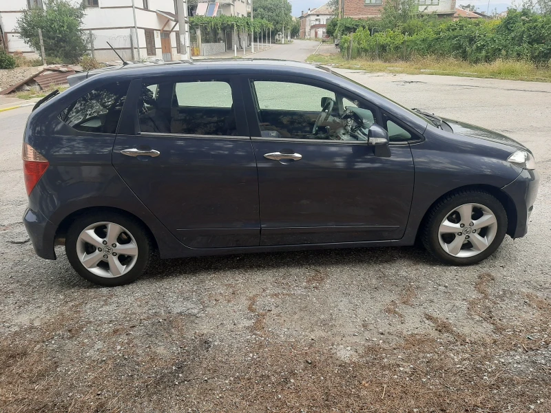 Honda Fr-v 1.8, снимка 16 - Автомобили и джипове - 48080136