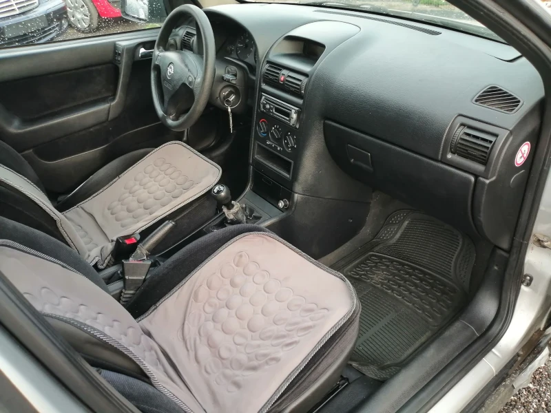 Opel Astra 1.4i КЛИМА 90кс, снимка 12 - Автомобили и джипове - 49795000
