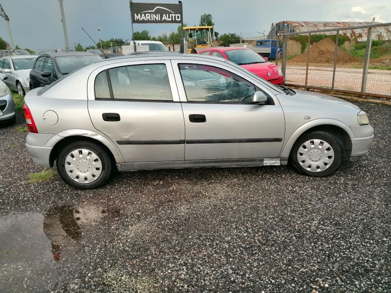 Opel Astra 1.4i КЛИМА 90кс, снимка 4 - Автомобили и джипове - 49795000