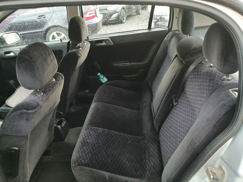Opel Astra 1.4i КЛИМА 90кс, снимка 11 - Автомобили и джипове - 49795000