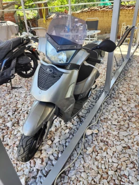     Kymco People S