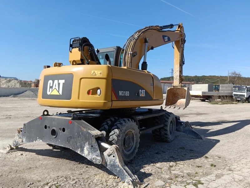 Багер Cat 318, снимка 1 - Индустриална техника - 47286666