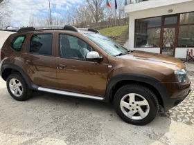 Dacia Duster 1.6i 4WD, снимка 3