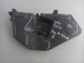 Водач държач предна броня десен Опел Тигра 