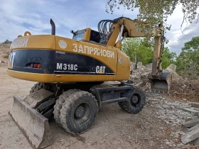 Багер Caterpillar M318C, снимка 4