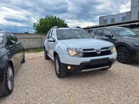     Dacia Duster 1.6i  + 