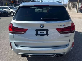 BMW X5M  * CARFAX * Хед-ъп * Harman Kardon * Червен салон  - 22050 € / 43126.05 лв. - 44142690 4