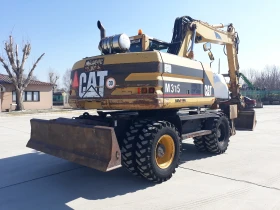  Caterpillar M315+ 3  | Mobile.bg    8