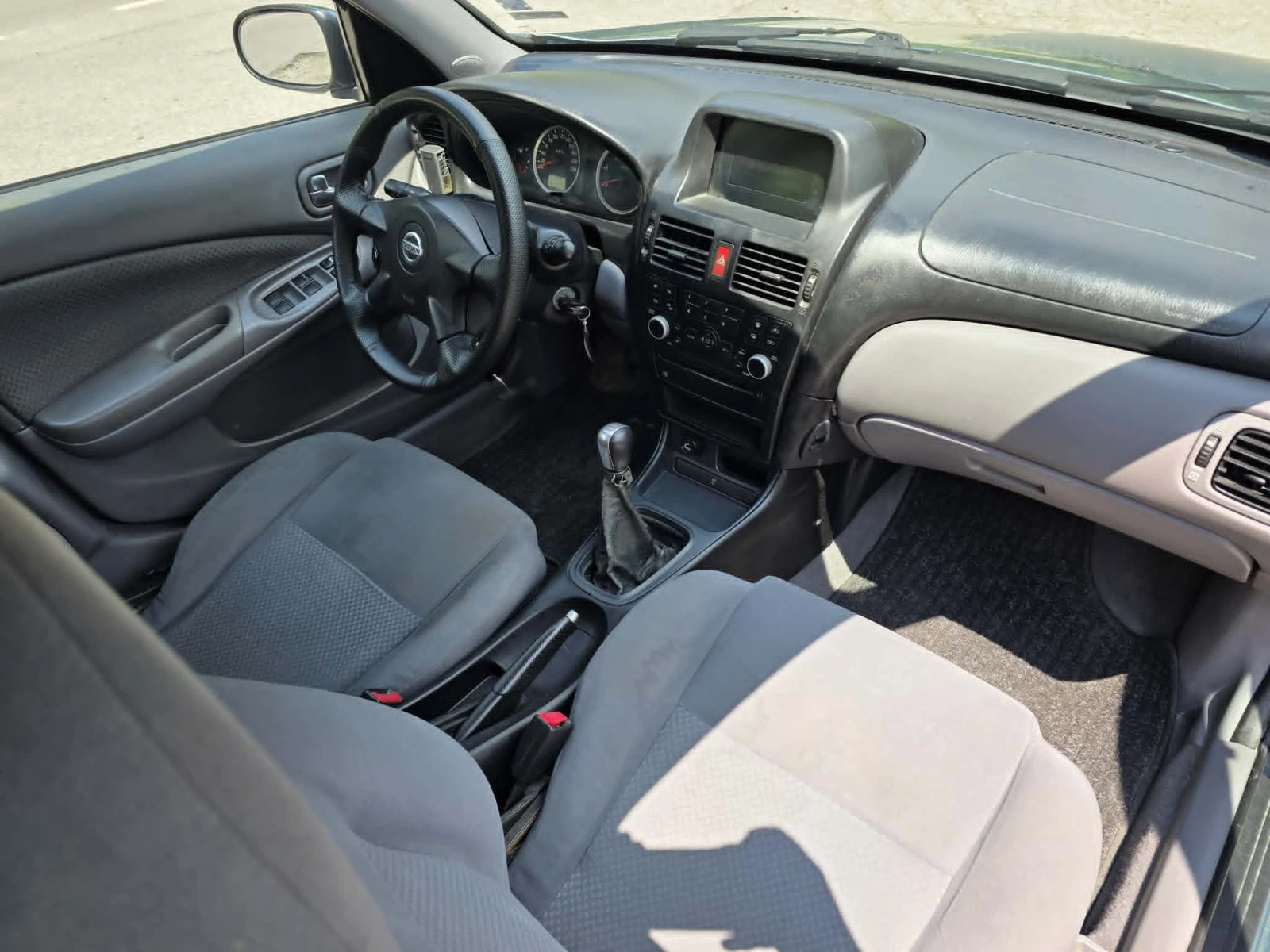 Nissan Almera 1.5 dci, снимка 13 - Автомобили и джипове - 55992846