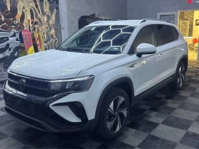 ������ VW Taos