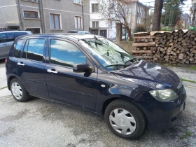 ������ Mazda 2