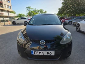 ������ Mazda 2