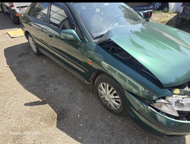 Mitsubishi Carisma 1.8GDI, снимка 4 - Автомобили и джипове - 47301890