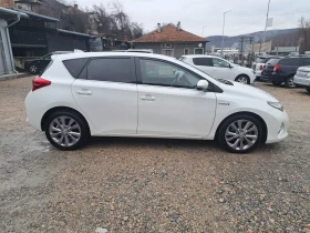 Toyota Auris 1.8 HYBRID* КЛИМА* NAVI* КАМЕРА* ТЕМПОМАТ - 10690 € / 20907.82 лв. - 26850325 6