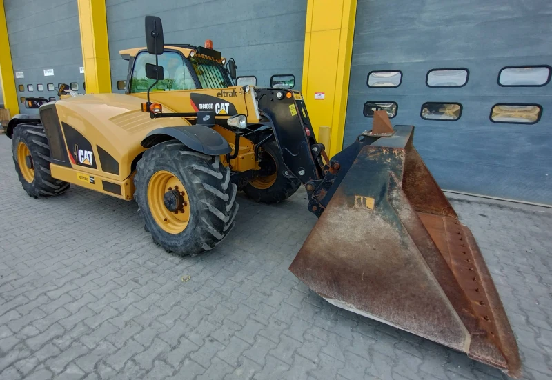 Телескопичен товарач Caterpillar 408D