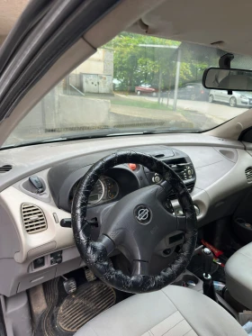 Nissan Almera tino Бензин/газ, снимка 8