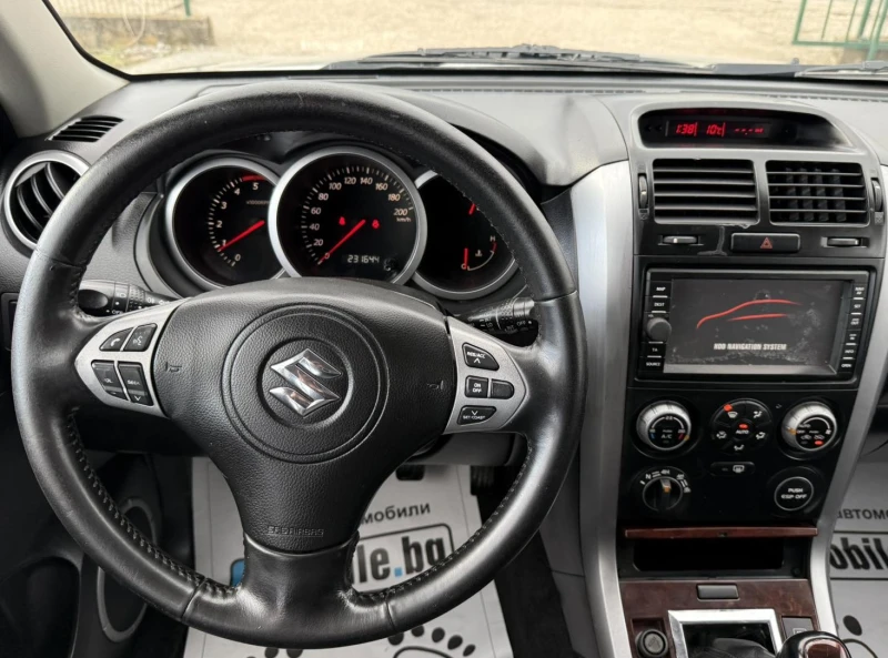 Suzuki Grand vitara 1.9DDiS КОЖА DVD-TV 4x4, снимка 11 - Автомобили и джипове - 51959629