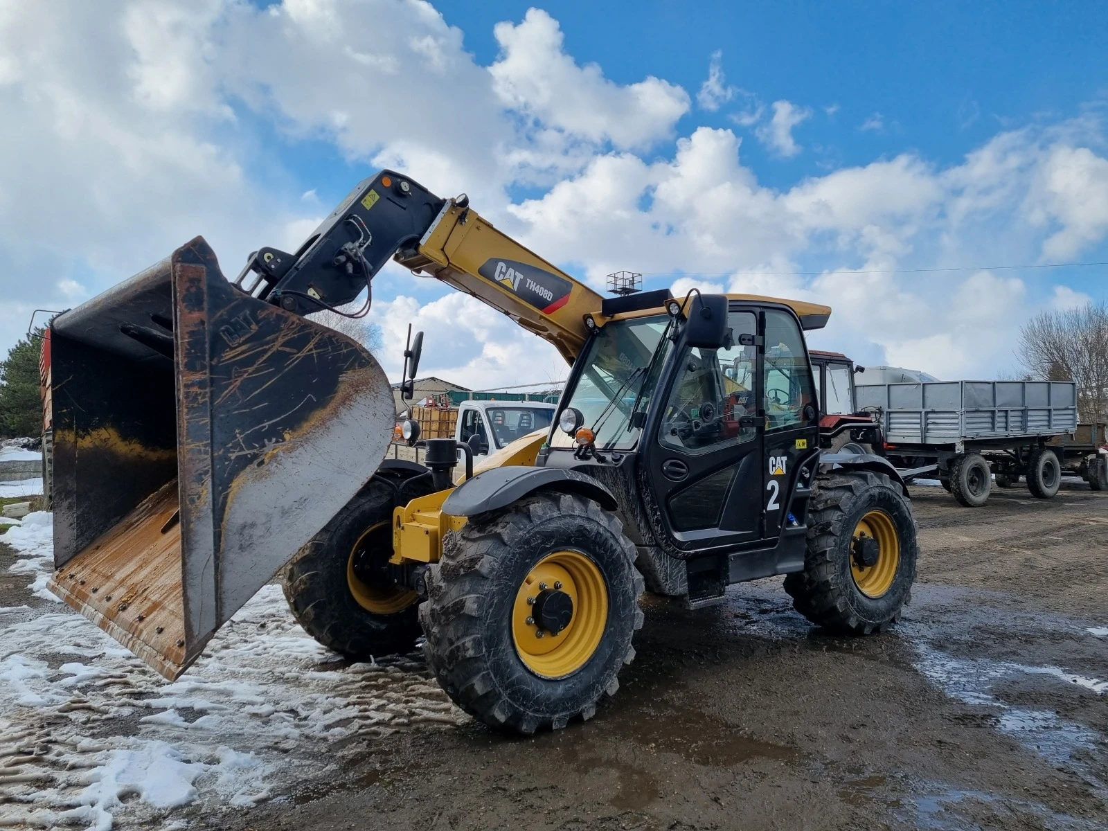 Телескопичен товарач Caterpillar 408D - изображение 2