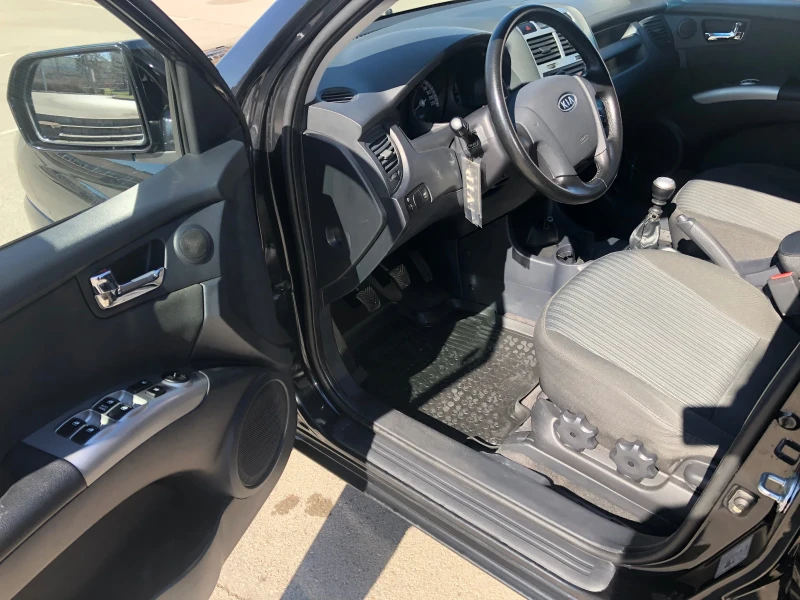 Kia Sportage 2.0 CRDI 4WD, снимка 7 - Автомобили и джипове - 51848605