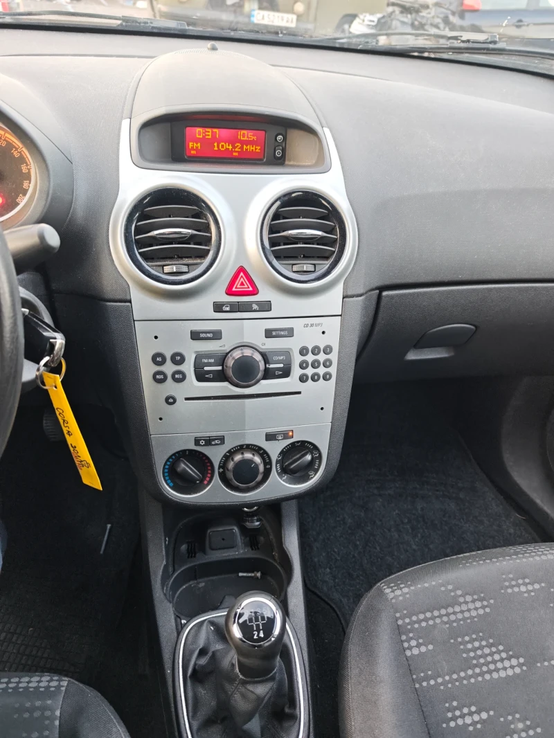 Opel Corsa 1.2i , снимка 11 - Автомобили и джипове - 52735589