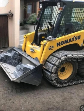        Komatsu SK 714  Super Flow