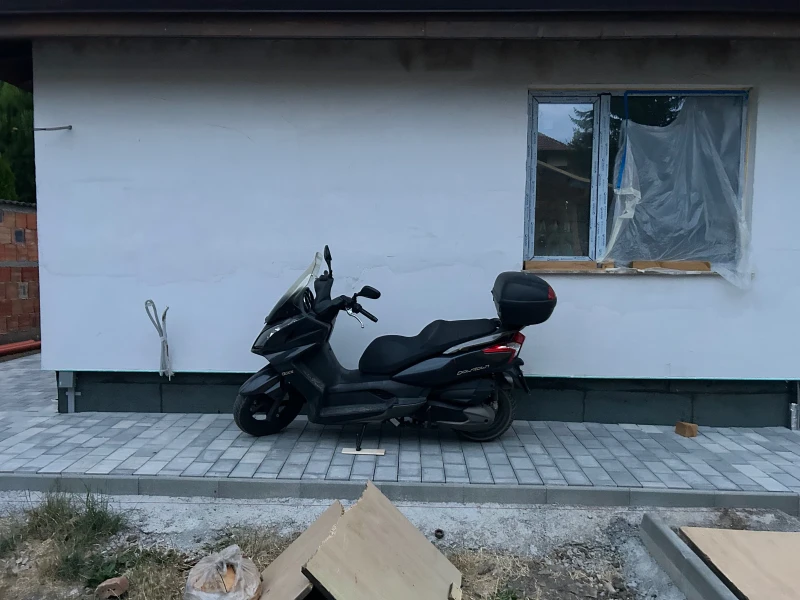 Kymco Downtown 300 кибика 30 коня