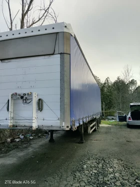 Полуремарке Schmitz Варио с ТУНЕЛ за рулони