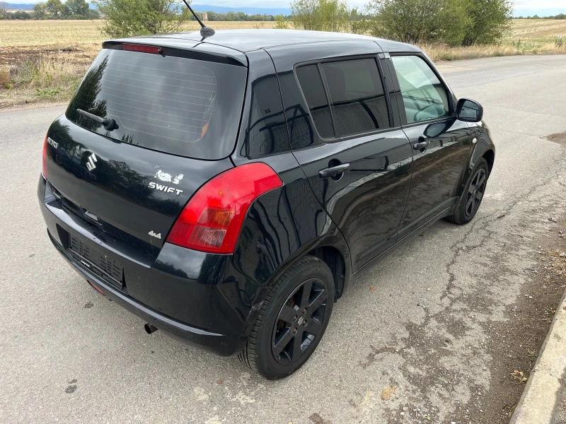 Suzuki Swift 1.3 4х4, снимка 7 - Автомобили и джипове - 52172812