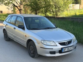 Mazda 323 1.3i КЛИМАТИК, снимка 1