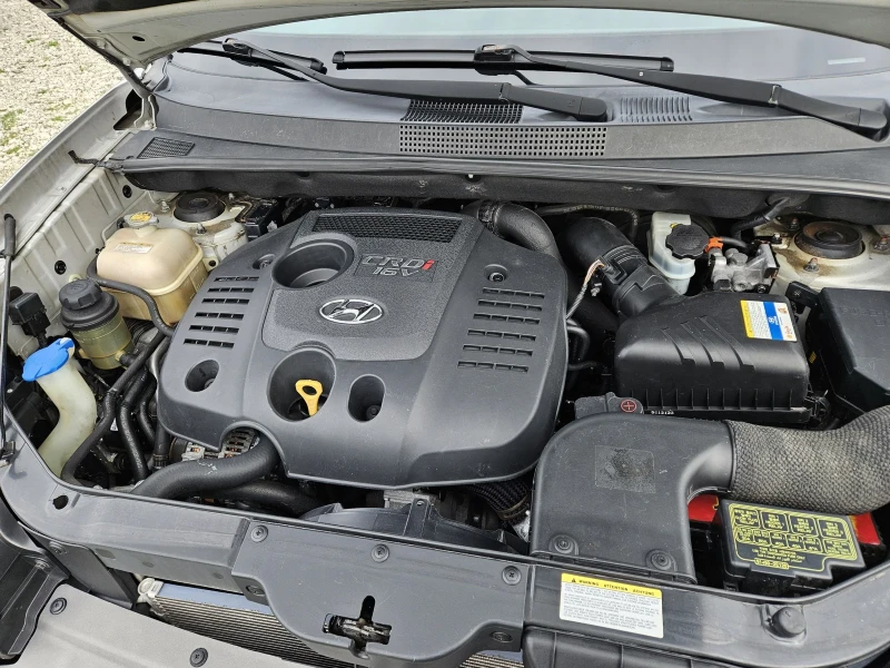 Hyundai Tucson 2.0 crdi, снимка 11 - Автомобили и джипове - 53475803
