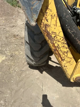 Телескопични товарачи Caterpillar CAT TH 414, снимка 9