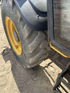 Телескопични товарачи Caterpillar CAT TH 414, снимка 10